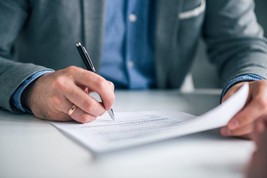 Business owner signing estate planning documents for a grantor retained annuity trust